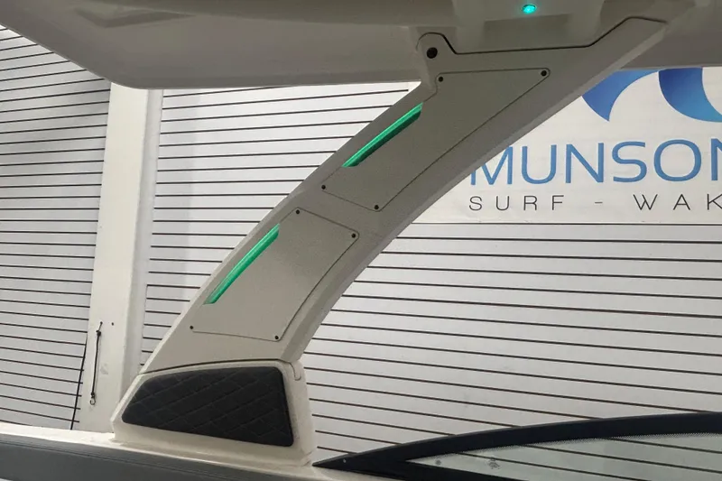 Slide: The Image of 2026 Chaparral 8 SSX boat detail with illuminated panel and sleek design. - 30