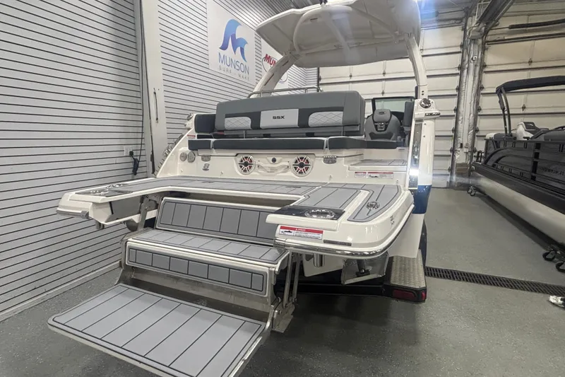 Slide: The Image of 2026 Chaparral 8 SSX boat with extended swim platform in showroom. - 36