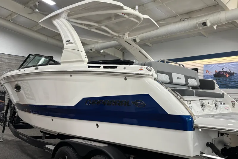 Slide: The Image of 2026 Chaparral 8 SSX boat displayed indoors, showcasing sleek design and modern features. - 38
