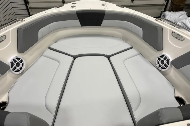 Slide: The Image of 2026 Chaparral 23 SSi boat interior with gray seating and built-in speakers. - 10