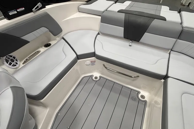 Slide: The Image of Interior seating of 2026 Chaparral 23 SSi boat, featuring gray and white upholstery. - 25