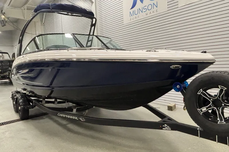 Slide: The Image of 2026 Chaparral 23 SSi boat on trailer in showroom, Munson Surf Wake. - 3