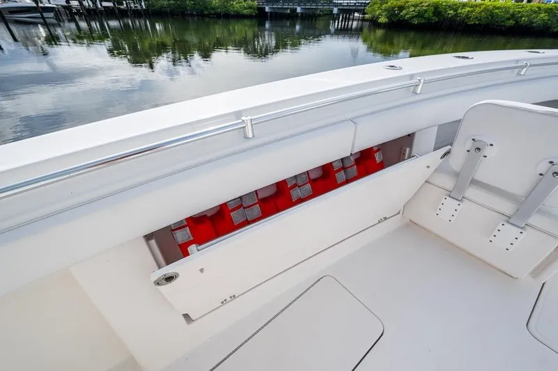 Slide: The Image of 2016 Invincible 39 Open Fisherman boat with life jackets stored onboard. - 12