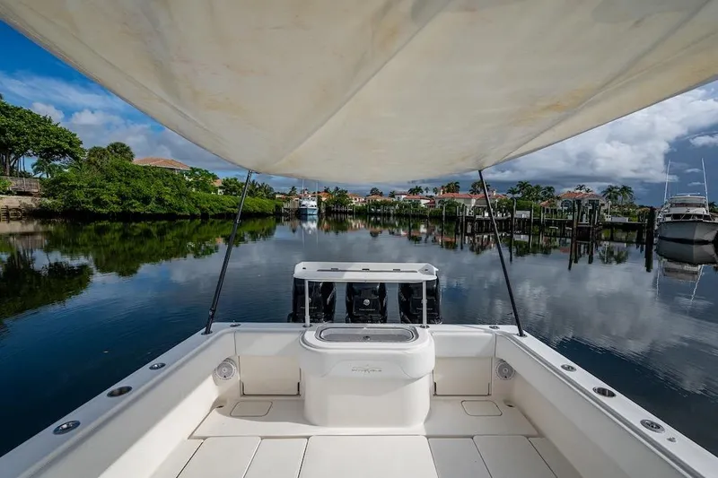 Slide: The Image of Invincible 39 Open Fisherman boat on calm water, 2016 model, scenic view. - 21