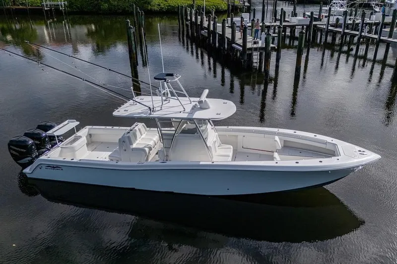 Slide: The Image of 2016 Invincible 39 Open Fisherman boat docked in calm waters. - 4