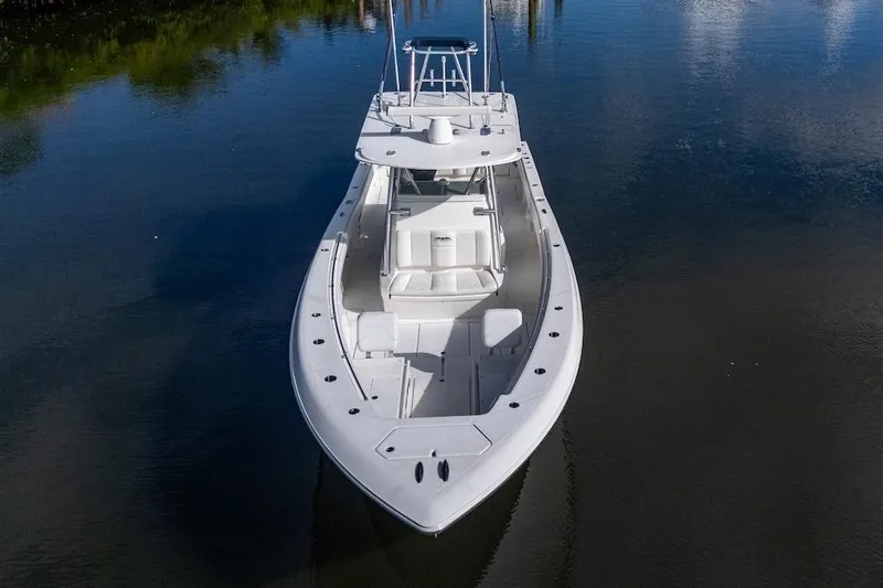 Slide: The Image of 2016 Invincible 39 Open Fisherman boat on calm water, aerial view. - 5