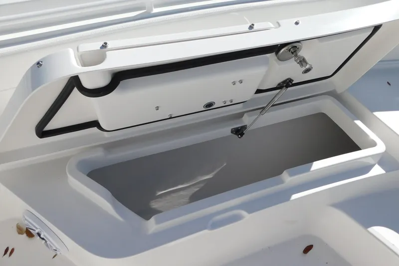Slide: The Image of Open storage compartment on 2026 Regulator 30XO boat, showcasing interior design and functionality. - 12