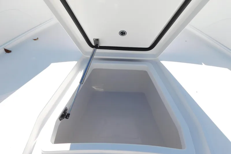 Slide: The Image of Open storage compartment on 2026 Regulator 30XO boat. - 13
