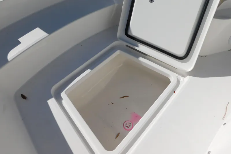 Slide: The Image of Open storage compartment on 2026 Regulator 30XO boat, showcasing interior space. - 14