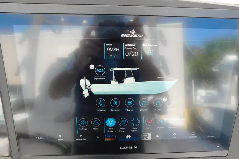 Slide: The Image of Garmin display on 2026 Regulator 30XO boat showing vessel controls and settings. - 23