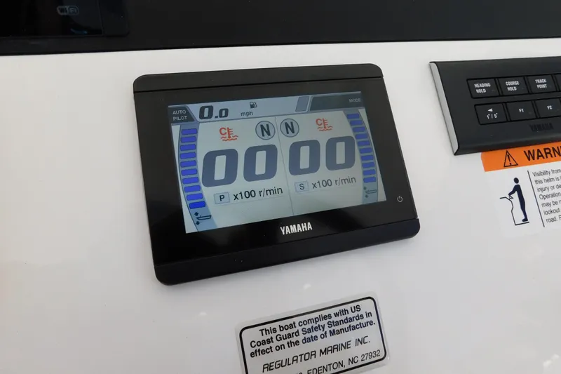 Slide: The Image of Yamaha display on 2026 Regulator 30XO boat dashboard with warning label. - 25