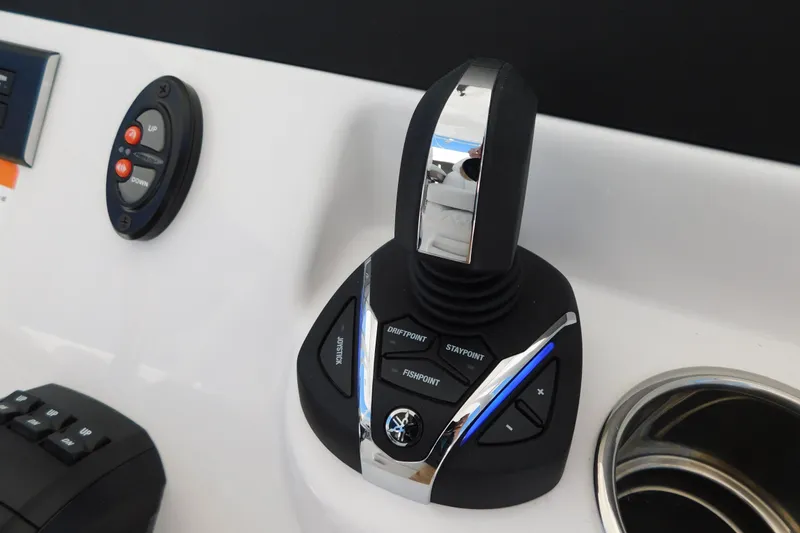 Slide: The Image of Control panel of 2026 Regulator 30XO boat with joystick and buttons. - 27