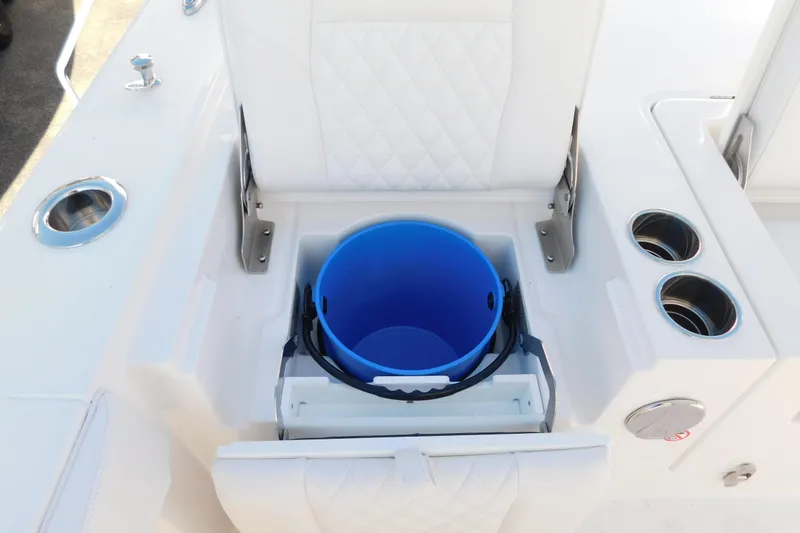 Slide: The Image of 2026 Regulator 30XO boat seat with integrated storage and blue bucket. - 31