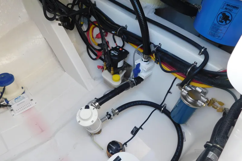 Slide: The Image of 2026 Regulator 30XO boat engine compartment with wiring and components. - 33