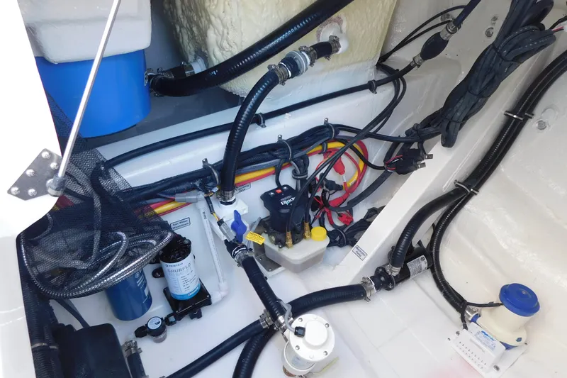 Slide: The Image of 2026 Regulator 30XO boat wiring and plumbing system in the engine compartment. - 34