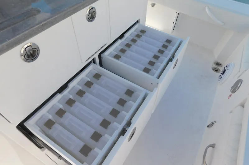 Slide: The Image of Storage drawers on the 2026 Regulator 30XO boat, featuring organized compartments. - 39