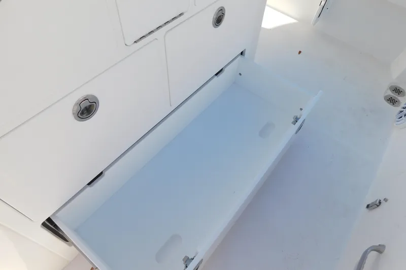 Slide: The Image of Open storage compartment on 2026 Regulator 30XO boat, showcasing sleek design and functionality. - 42