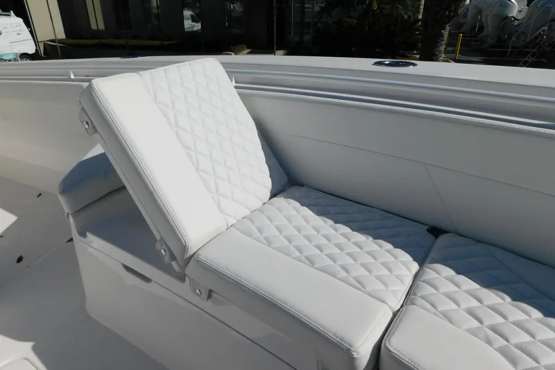 Slide: The Image of Luxurious white seating on 2026 Regulator 30XO boat, featuring quilted upholstery design. - 43