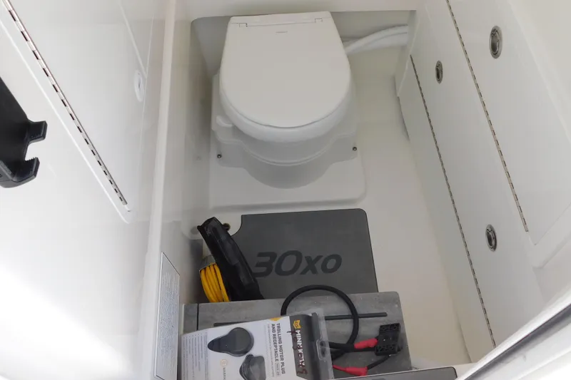 Slide: The Image of 2026 Regulator 30XO boat interior with toilet and storage compartments. - 48