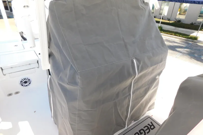 Slide: The Image of 2026 Regulator 30XO boat with protective cover on deck. - 58