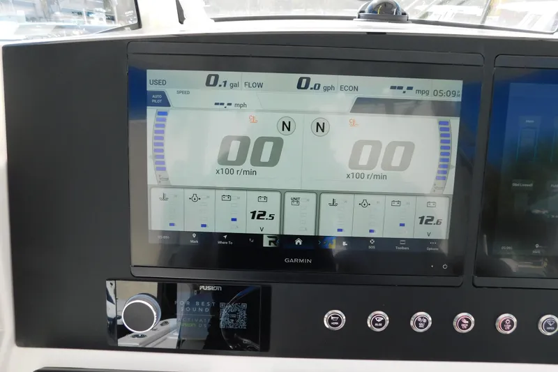Slide: The Image of Garmin display on 2026 Regulator 30XO boat dashboard showing engine metrics. - 6