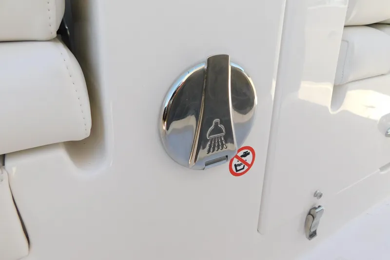 Slide: The Image of Regulator 30XO 2026 boat shower control with no shoes symbol. - 63