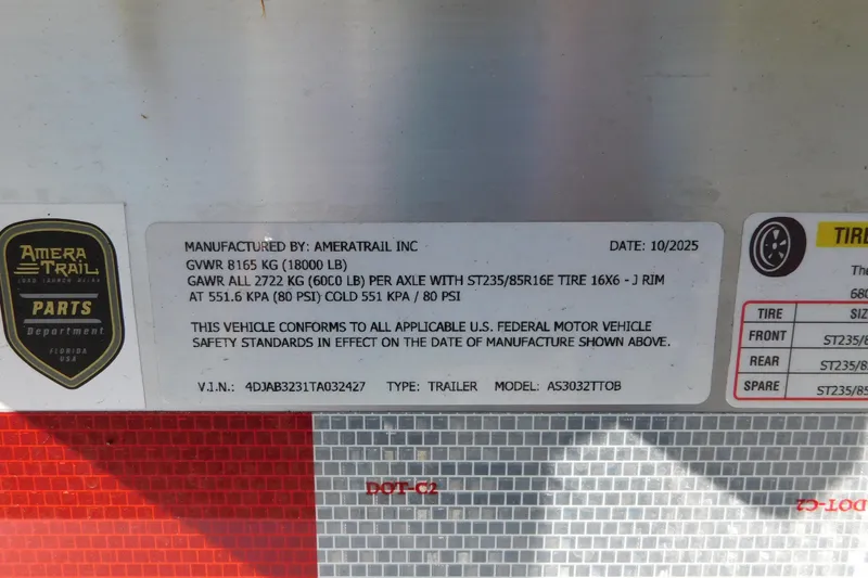 Slide: The Image of Amera Trail trailer label with specifications, including GVWR, GAWR, tire size, and manufacturing date. - 73