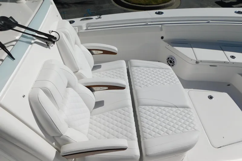 Slide: The Image of 2026 Regulator 30XO boat with luxurious white seating and modern design. - 8