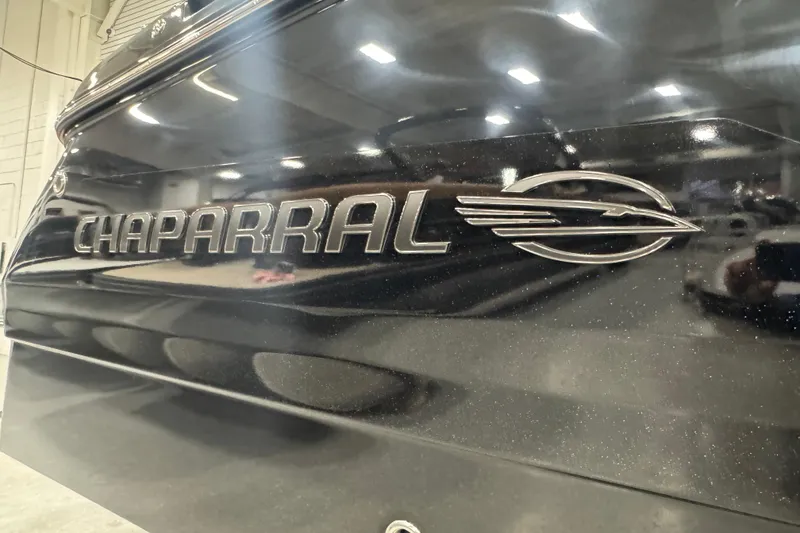Slide: The Image of 2026 Chaparral 6 SSX boat logo in a showroom setting. - 4