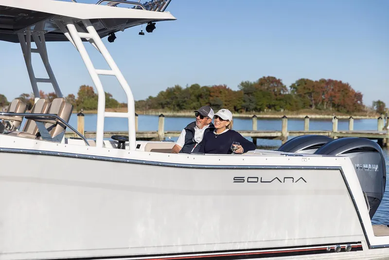 Slide: The Image of Manufacturer Provided Image: Couple enjoying a ride on a 2025 Solara S-310 CW boat. - 21