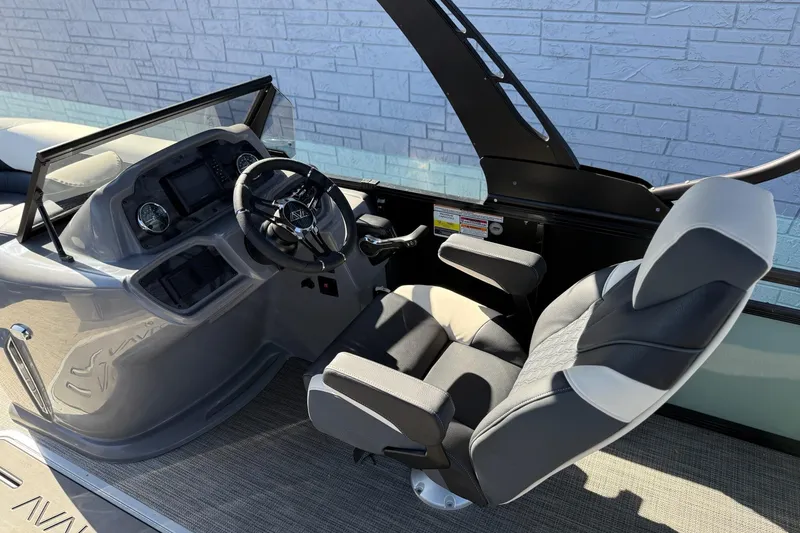 Slide: The Image of 2026 Avalon 2385 LSZ VRB boat interior with modern steering console and comfortable seating. - 12
