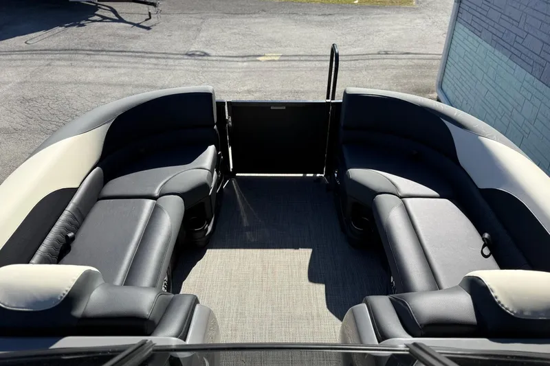 Slide: The Image of 2026 Avalon 2385 LSZ VRB Windshield boat interior with sleek seating design. - 13