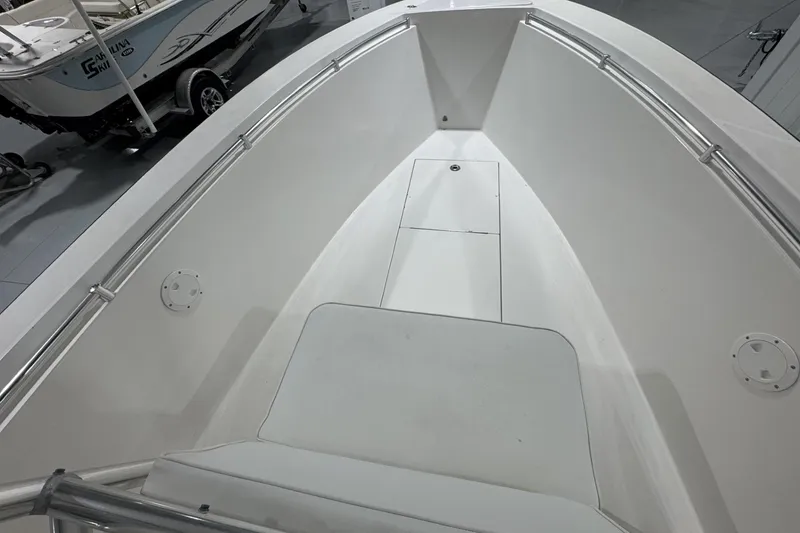 Slide: The Image of 2009 Contender 21 Open boat interior with clean white deck and stainless steel railings. - 11