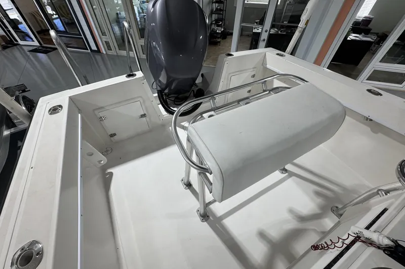 Slide: The Image of 2009 Contender 21 Open boat interior with seating and motor, showcasing spacious design. - 3