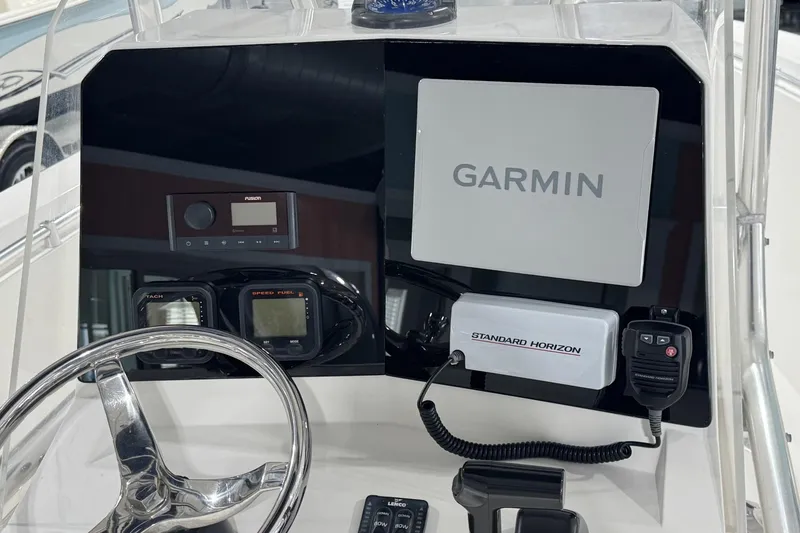 Slide: The Image of Console of 2009 Contender 21 Open boat with Garmin and Standard Horizon equipment. - 4