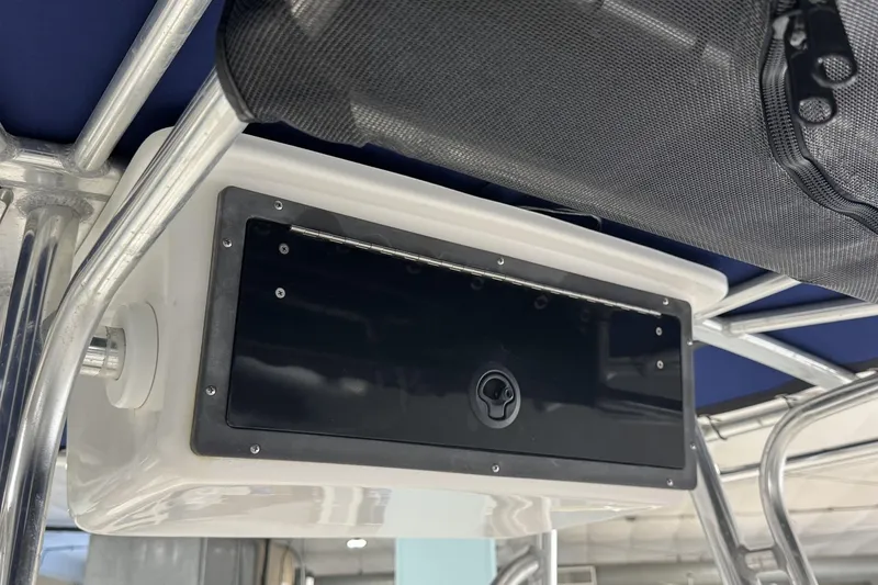 Slide: The Image of 2009 Contender 21 Open boat console with storage compartment and metal framework. - 7