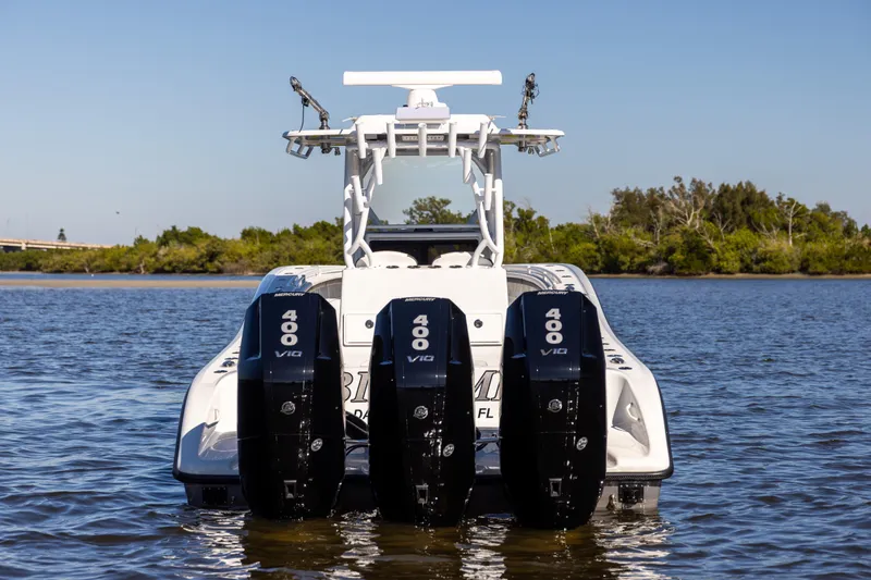 Slide: The Image of 2023 Yellowfin 36 Offshore boat with triple Mercury 400 V10 engines on water. - 17