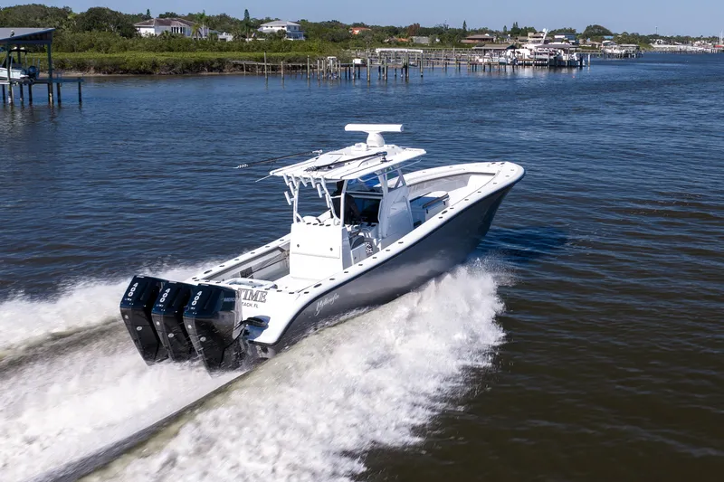Slide: The Image of 2023 Yellowfin 36 Offshore boat cruising on a calm river. - 19
