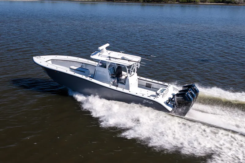 Slide: The Image of 2023 Yellowfin 36 Offshore boat cruising on open water at high speed. - 25