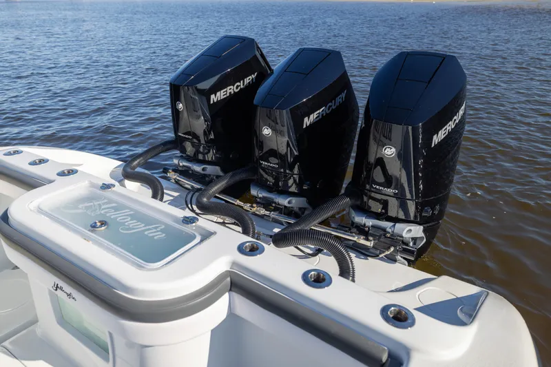 Slide: The Image of 2023 Yellowfin 36 Offshore boat with triple Mercury Verado engines on water. - 31