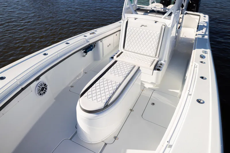 Slide: The Image of 2023 Yellowfin 36 Offshore boat interior with white seating and sleek design. - 51