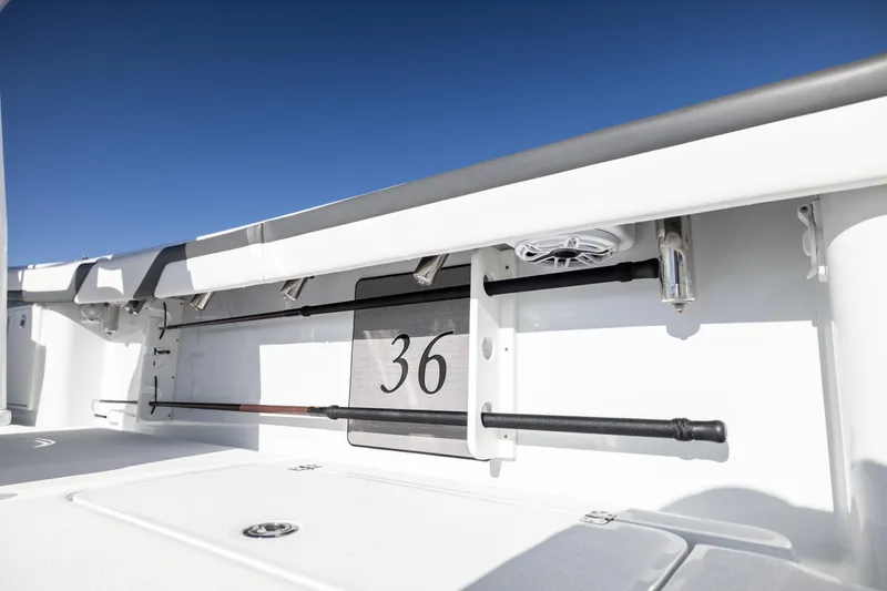 Slide: The Image of 2023 Yellowfin 36 Offshore boat interior detail with rod holders and storage. - 57
