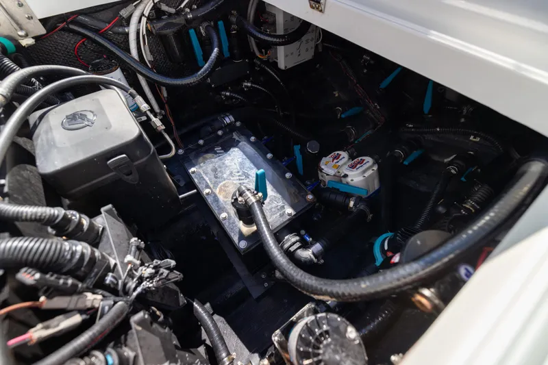 Slide: The Image of Engine compartment of 2023 Yellowfin 36 Offshore boat, showcasing wiring and components. - 61