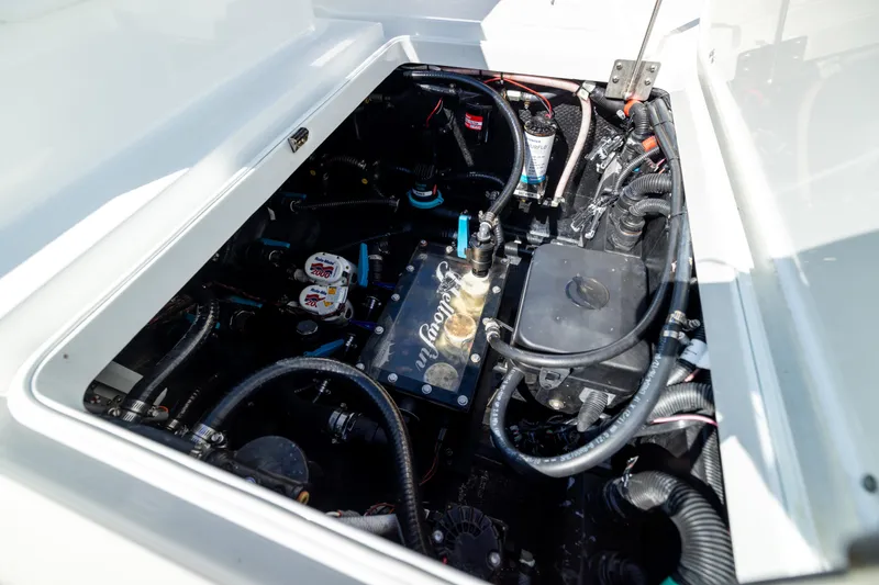Slide: The Image of Engine compartment of 2023 Yellowfin 36 Offshore boat, showcasing intricate wiring and components. - 62