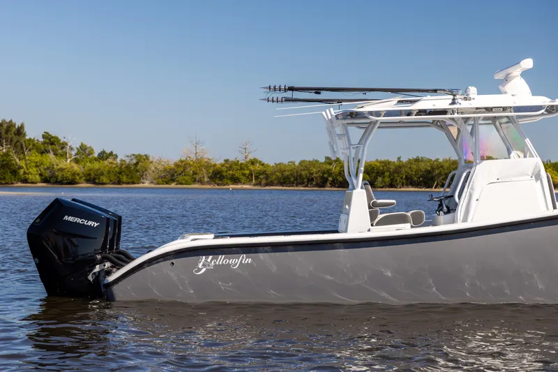 Slide: The Image of 2023 Yellowfin 36 Offshore boat on calm water with Mercury engine. - 8