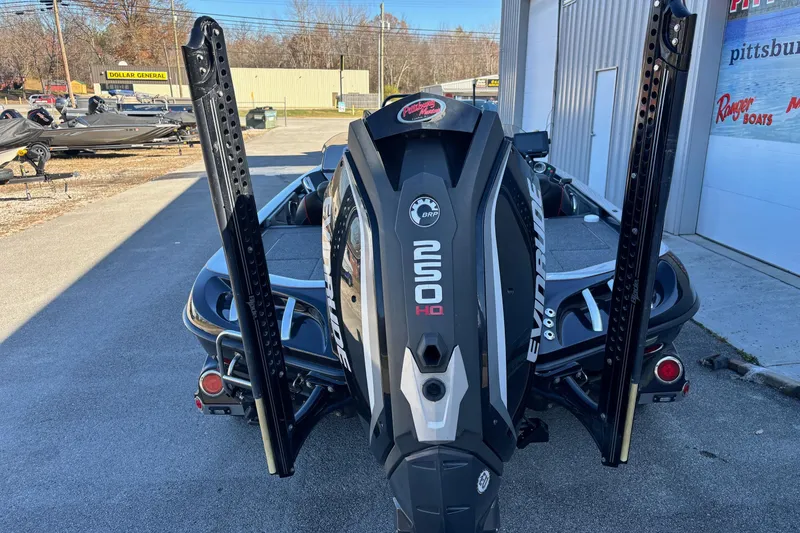 Slide: The Image of 2017 Ranger Z521 Comanche boat with Evinrude engine, parked outside a dealership. - 21