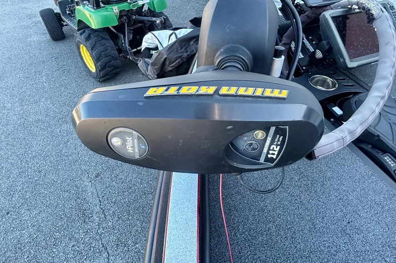 Slide: The Image of 2017 Ranger Z521 Comanche with Minn Kota trolling motor on a textured surface. - 4