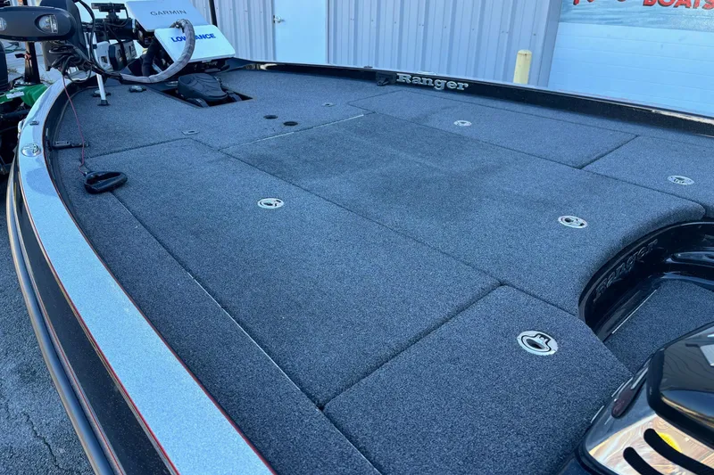 Slide: The Image of 2017 Ranger Z521 Comanche boat deck with fishing equipment and storage compartments. - 6