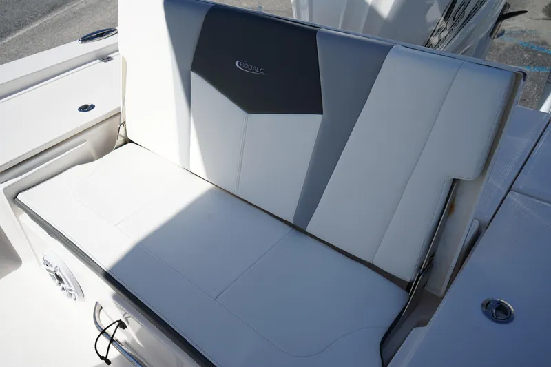 Slide: The Image of 2023 Robalo 266 Cayman boat seat with sleek white and gray design. - 16