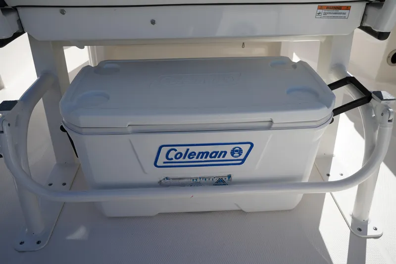Slide: The Image of White Coleman cooler on 2023 Robalo 266 Cayman boat deck. - 17